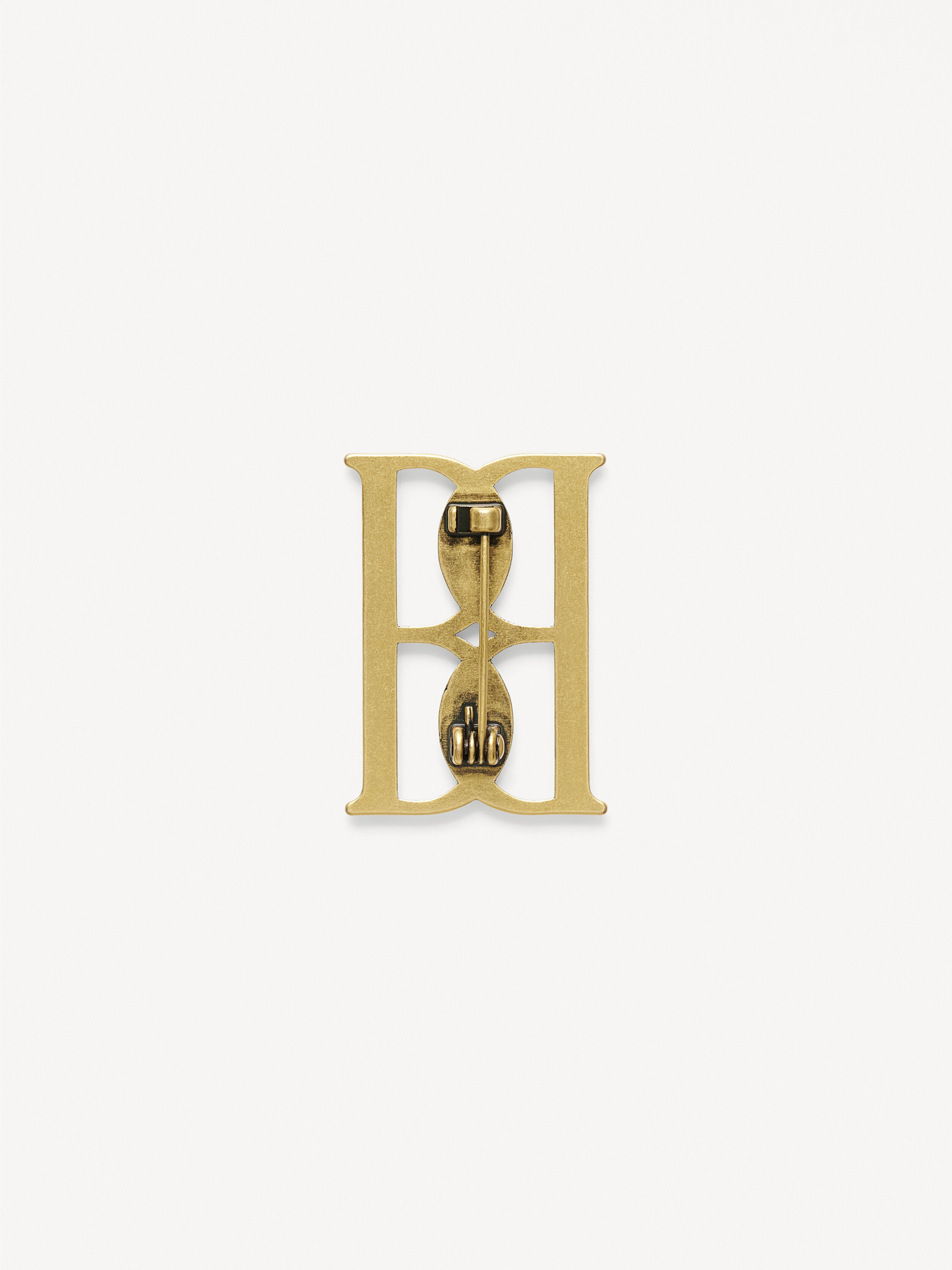 Mono small gold-tone brooch
