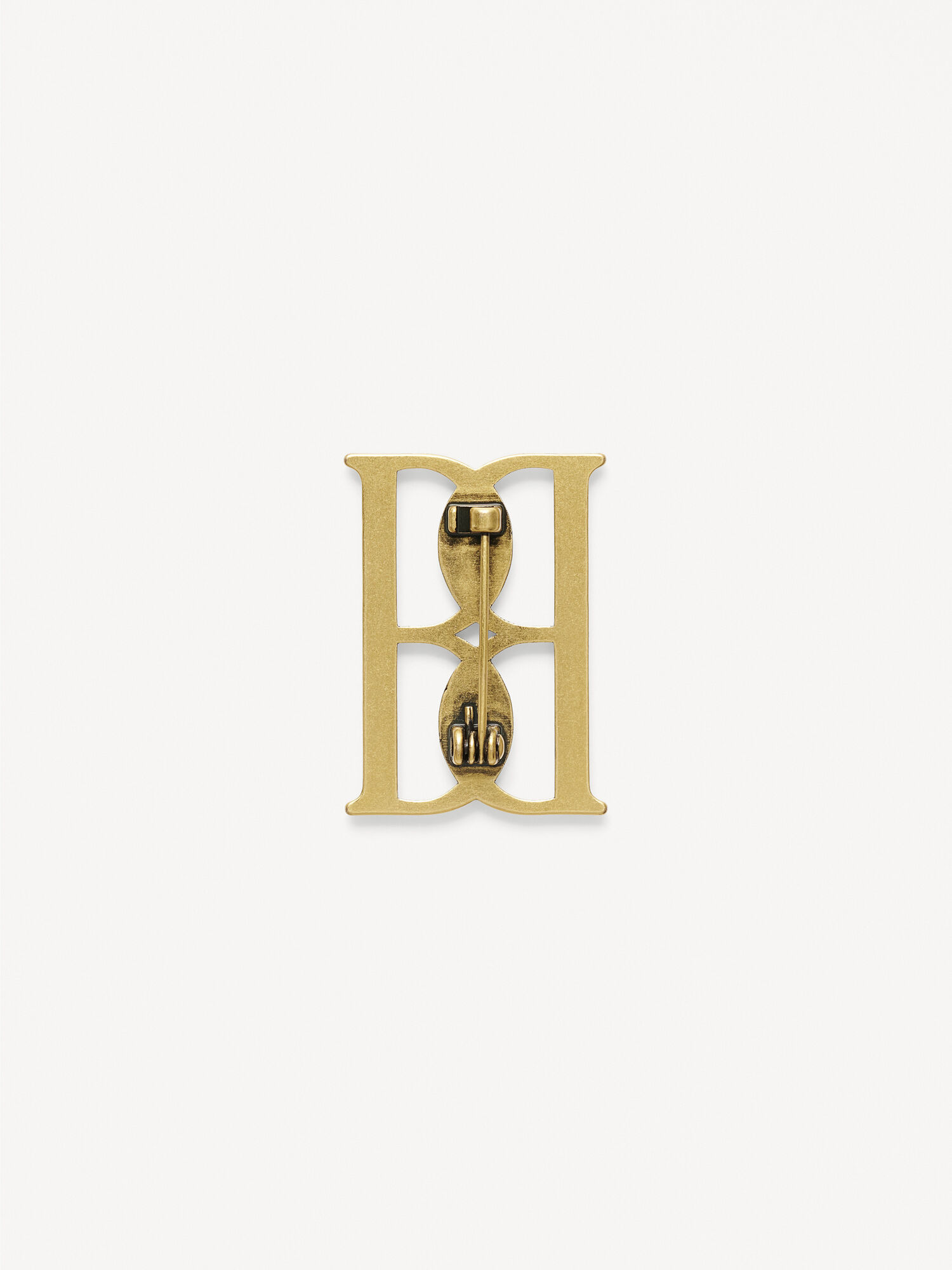 Mono small gold-tone brooch